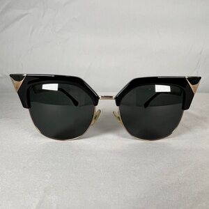 Fendi cat eye black and gold sunglasses.